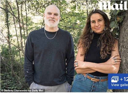 A man with a beard and a woman with long, curly hair stand outdoors, both smiling subtly. "Daily Mail" is visible at the top, along with a "+12 View gallery" button at the bottom right.